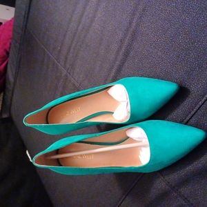 Green spike heeled shoes